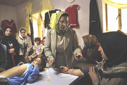 Members of the jail committee discuss the contents of the next issue of the prison newspaper. © IRIN